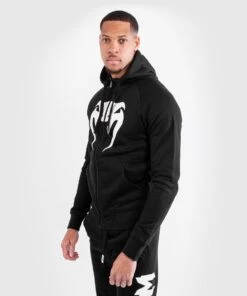 Venum Hoodie Legacy - Black/white -Fighters Europe Shop f2c4ce25304963c0b48d35a214cd2933977c1239 HOODIES LEGACY BLACK WHITE 02